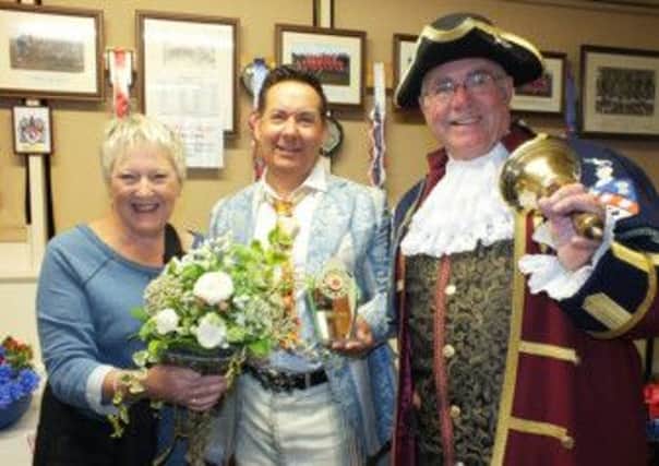ENJOYABLE DAY Pam Rae with Carl Wilde and town crier Laurie Gilbert.