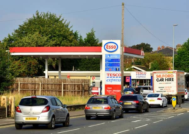 Cars often have to wait to turn into the Esso Garage and Tesco Express store.