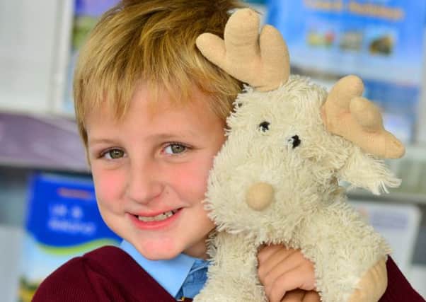 REINDEER GAMES Seven-year-old Josh Senior reunited with his teddy Rudy (D543C437).