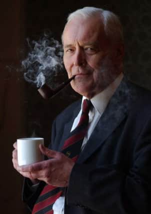 Tony Benn with trademark pipe and cuppa