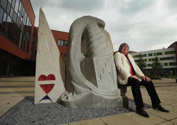 GIVING THANKS Ossett-based artist Stephen Hines, who has suffered two strokes, with the sculpture The Tree of Life.