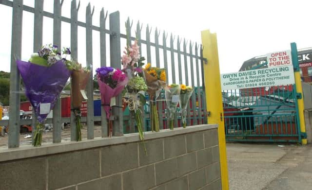Flowers left outside the Gwyn Davies recycling plant after Mr Brook's accident.  (d611c234)