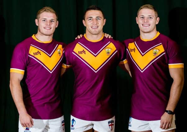 Australian Star Sam Burgess (centre) with brothers Tom and George in Dewsbury Moor jerseys during last years Rugby World Cup, while (below) passing on tips to Moors ladies team.