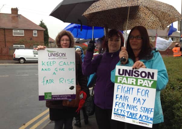 TAKING A STAND: Strikers at Dewsbury and District Hospital.