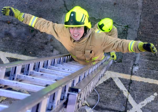Reporter Richard Beecham takes part in a special fire service event. Taking part in drills and training with the Mirfield fire station crew. (D551G441)