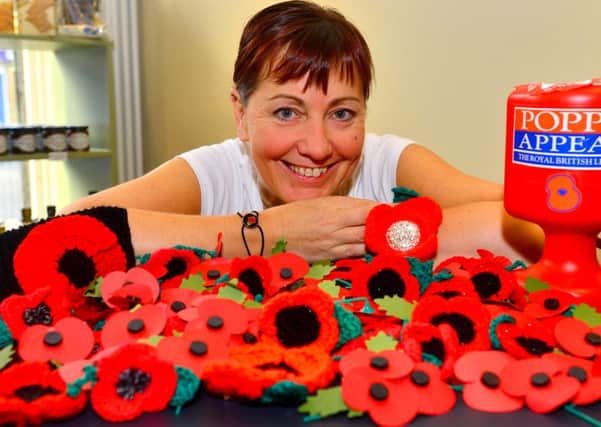 Carol Rodwell has helped make 995 crocheted poppies. (D531A445)