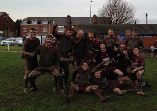 jubilant scenes: Thornhill players celebrate their impressive 16-10 victory over Pennine League Premier Division champions Sharlston Rovers.