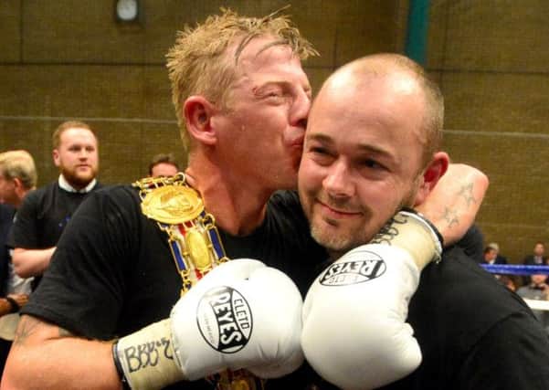 Close bond: Gary Sykes and trainer Julian McGowan celebrate the Dewsbury mans British title victory in May.