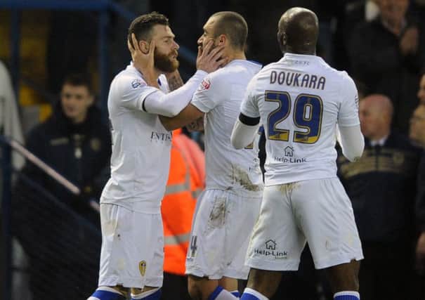 Mirco Antenucci is congratulated on his opening goal against Derby County by Leeds United team-mate Tommaso Bianchi.