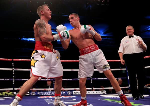 Liam Walsh rocks Gary Sykes with a stinging upper cut. Pictures: PA Wire/Press Association Images