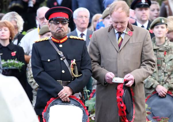 PAYING RESPECTS: Mourners at Mirfields Remembrance service.