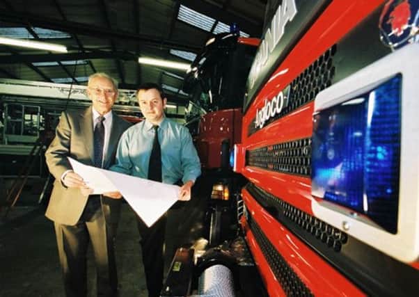 Angloco director Bill Brown, and engineering manager Neville Parker look at plans for a new vehicle at the Batley factory. (NS)