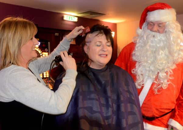 Caroline Williams, a veteran, is having her head shaved for forces charities at The Obediah Brooke. (d611b452)