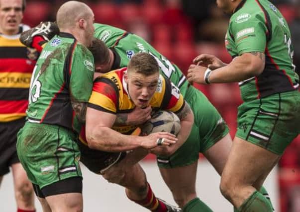 Tom Lillycrop in derby action during his spell with Dewsbury Rams, looks set to line-up against his former club in his first appearance for Batley.