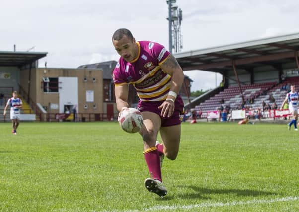 Picture by Allan McKenzie/AMGP - Rugby League - Kingstone Press Championship - Batley Bulldogs v Rochdale Hornets, Mount Pleasant, Batley, England - 080614 - Batley's Miles Greenwood touching down to score.