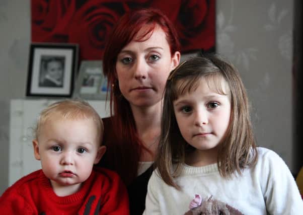 Rebecca Jestico and her children, Evie and Nicholas  are having trouble being re-housed from their house, which has a number of problems, including damp.