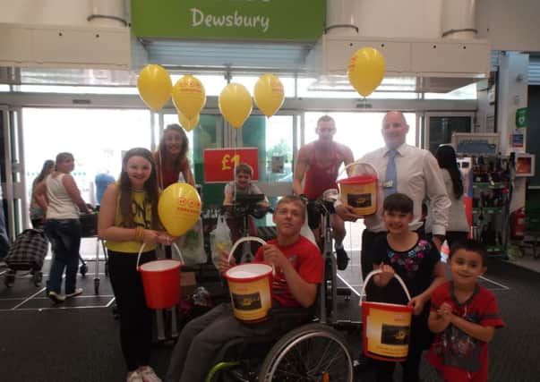 Asda Dewsbury and St Paulinus Primary School pupils raising money for YAA.