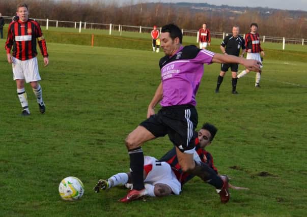 Lee Ryan wins a challenge for Thornhill against Old Modernians. Pictures: David Jewitt.
