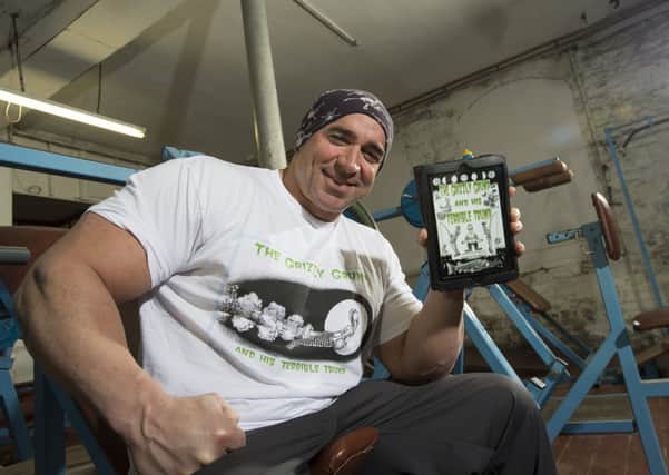 Sam the Man training in a private gym with his book on tablet.