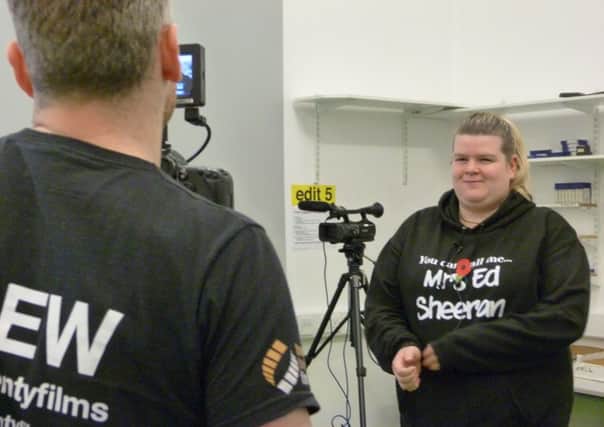 Media student Charlotte Hirst at Highfields Centre, Huddersfield, being filmed.