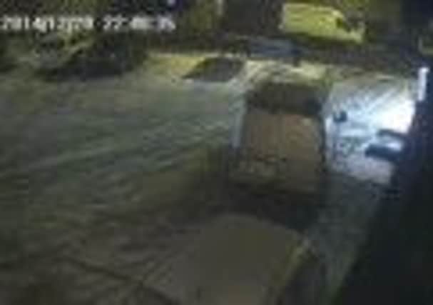 Police released an image of a van, pictured in the background, used in the theft of motorbike in Hightown, Liversedge.