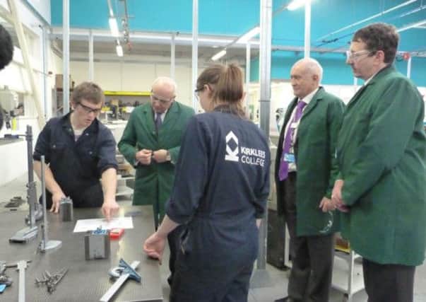 Apprentices Tom Fox and Annabel Burgess with Iain Duncan Smith.