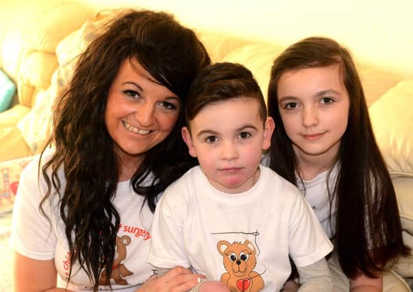 Emma Brook, 36, with son Alfie and his sister, Chloe, 12 . (d624a507)