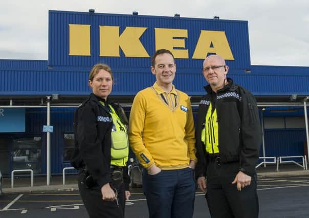 Ikea store manager Scott Renshaw with PC Louise Hurst and PCSO Mike Chadwick.
