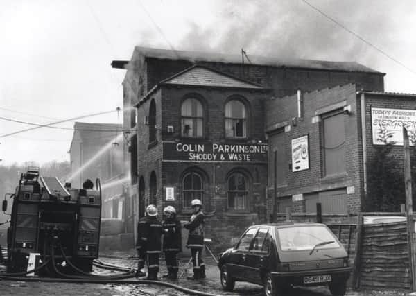 Firemen tackle a blaze at Colin Parkinson Limited Shoddy and Waste, Batley Carr, in 1995.