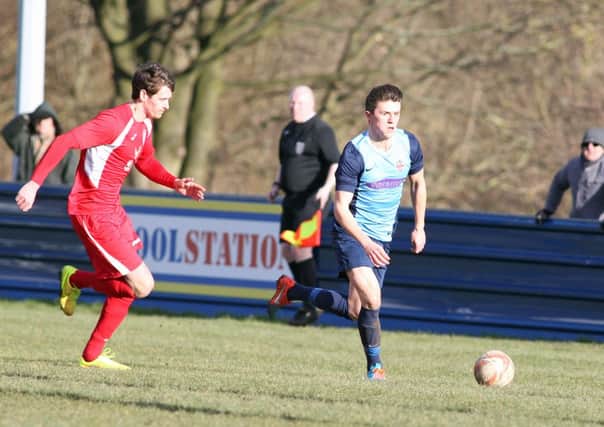 Liversedge's Mitchell Pearson takes on an Armthorpe defender last Saturday.