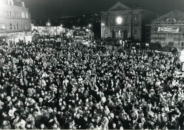 TOWN CELEBRATION Do you remember why this large crowd gathered in Batley Market Place in 1994?