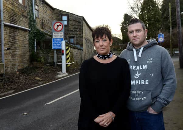 HAD ENOUGH Marie Kane and Chris Dodsly outside their home.