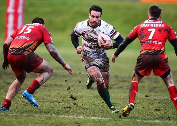 Jason Crookes and Anthony Thackeray look to make a tackle on Hunslets Danny Maun during last Sundays Kingstone Press Championship clash. Pictures: Paul Butterfield