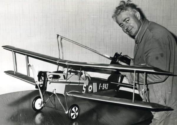 Ronnie Gibson with his vintage warplane in 1977.