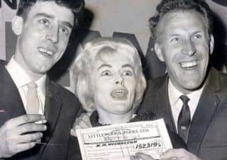 Viv Nicholson and husband Keith collect their Littlewoods pools cheque from Bruce Forsyth