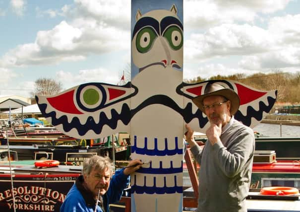 Peter Thorn and Peter Davies with one of the magnificent totem poles!