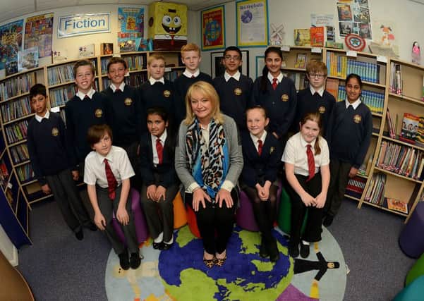 Newspaper: Mirfield Reporter.
Story: Crossley Fields school gets a flawless Ofsted report - 1's in everything!
Picture show head teacher Catherine Lockwood with some pupils.
Photo Date: 06/05/15
Photo Ref: AB023a0515