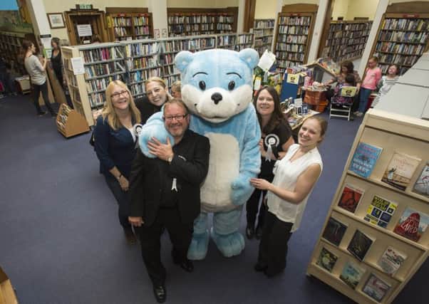 Mandy Huggins, Pauline Scatterty, Martin Webster, Karen Naylor and Laura Hobson-Tyas with Bookstart Bear at Cleckheaton Literature Festival.