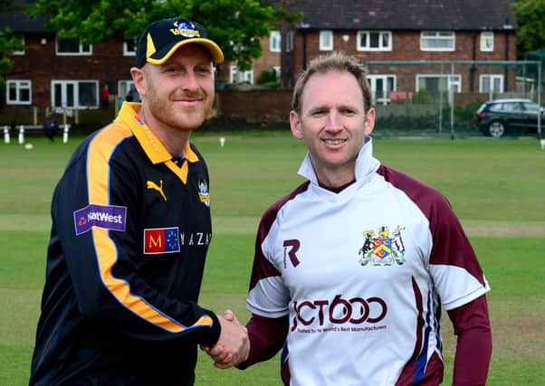 Yorkshire captain Andrew Aale with Bradford League's Gary Fellows.