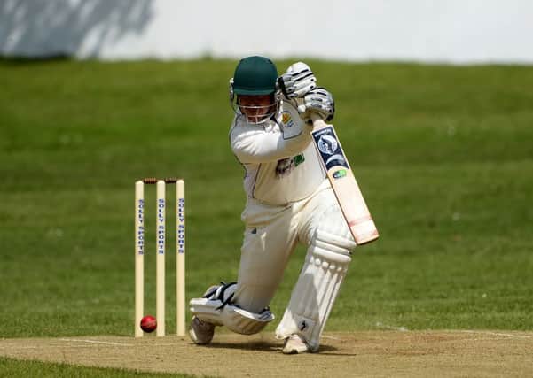 Hopton Mills batsman Andrew Grey on the drive during Saturdays Central Yorkshire League Championship game against Azaad. Picture: Paul Butterfield.