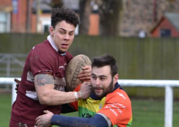 Joel Gibson scored a hat-trick of tries as Thornhill Trojans overcame a determined effort from Wibsey.