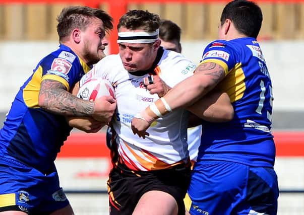 Rams prop Ryan Hepworth attempts to break through a tackle by Doncaster duo Mike Emmett and Mitch Clark.