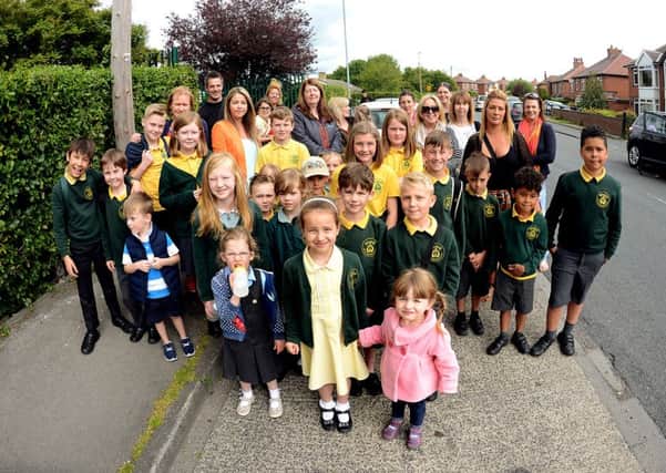 Newspaper: Reporter Series.
Story: Parents of pupils who attend Windmill CoE primary school are concerned that there will be no safe place to cross the road oputside the school when their lollipop lady retires.
Photo Date: 09/06/15
Picture Ref: AB069a0615