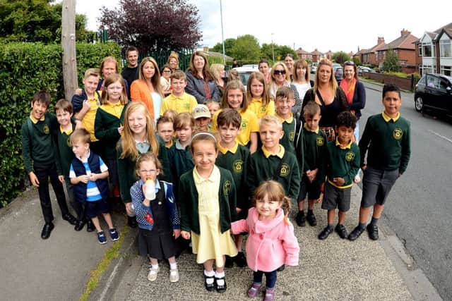 Parents of pupils who attend Windmill CoE primary school are concerned that there will be no safe place to cross the road oputside the school when their lollipop lady retires. Photo Date: 09/06/15 Picture Ref: AB069a0615