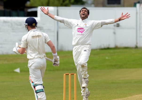 Spen Victorias Abid Awan celebrates claiming his wicket of Morley batsman James McNichol.
