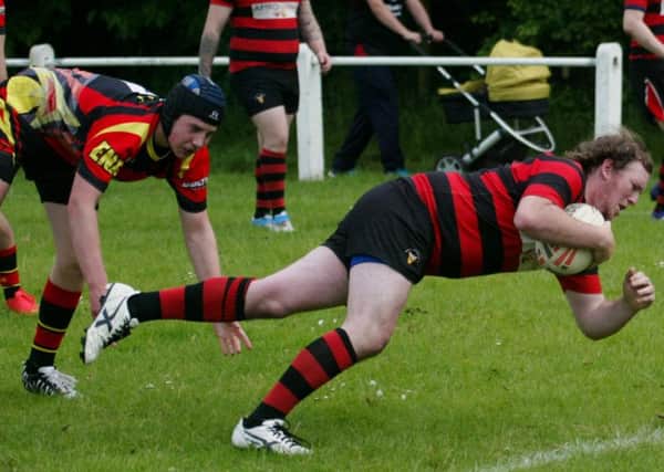 Ryan Jackson dives over for one of Birstall Vics 13 tries last Saturday.