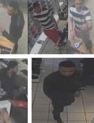 CCTV images of men police would like to identify to speak to in connection with the theft of a mans wallet in Leeds city centre.