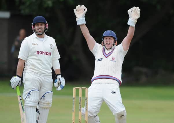 Chris Brice of Woodlands is trapped lbw during his side's Heavy Woollen Cup semi-final against Pudsey Congs last Sunday.