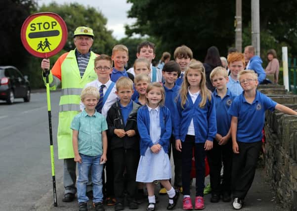 81 year old Matthew Fawcett, Scholes First and Nursery School lollipop man, received a Local Heroes award from the Pulse radio station