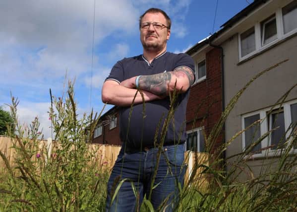 Paul Smith at his privately-owned home was shocked when she received a letter from authorities telling him to cut his grass.